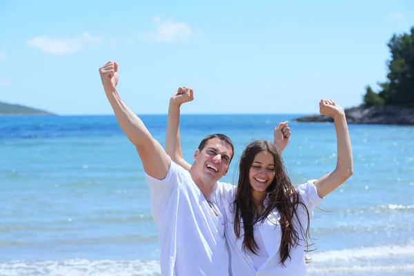 Couple have fun at the beach — Stock Photo, Image