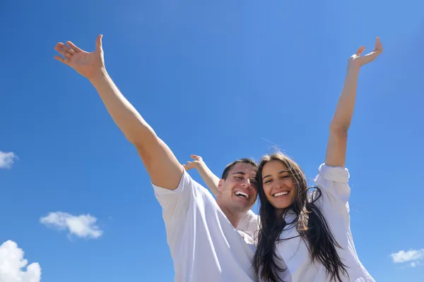 Couple have fun at the beach Stock Picture