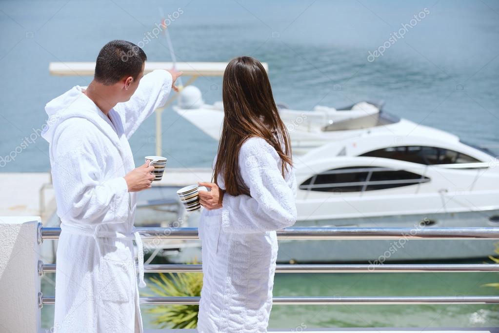 Couple next to yacht