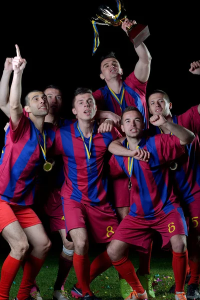 Jogadores de futebol comemorando vitória — Fotografia de Stock