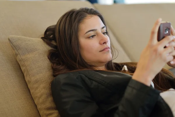 Relaxed young woman at home — Stock Photo, Image