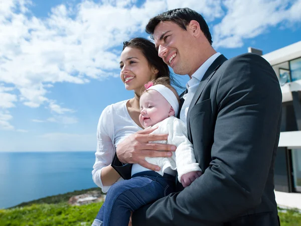 Happy young family at home — Stock Photo, Image