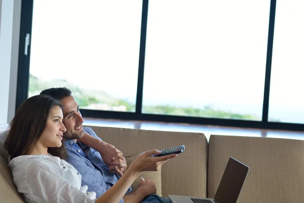 Couple on sofa — Stock Photo, Image