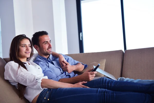 Couple on sofa — Stock Photo, Image