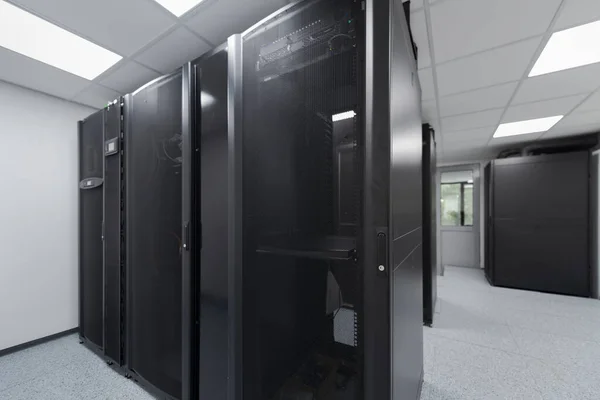 Data Center With Multiple Rows of Fully Operational Server Racks. Modern Telecommunications, Cloud Computing, Artificial Intelligence, Database, Supercomputer Technology Concept. High quality photo