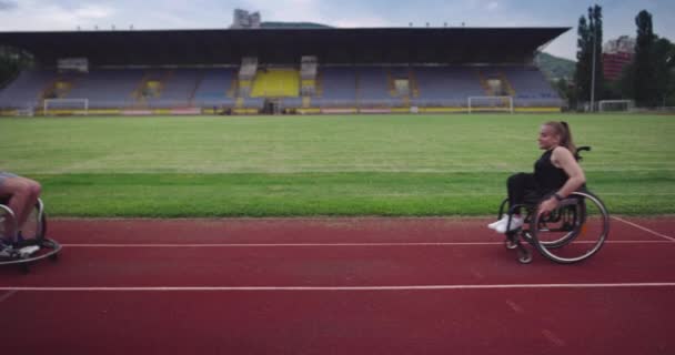 Hero portrait shot of disabled sport people on athletics sports track. — Stock Video