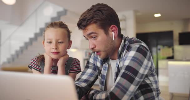 Young woman freelancer working remotely using laptop from home and asking son to not disturb. Mother is participating in video conference and the little boy is running, playing, and distracting. — Stock Video