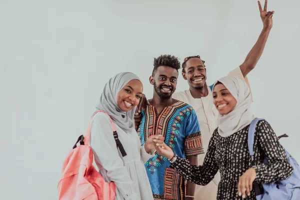 Group of happy african students having conversation and team meeting working together on homework girls wearing traidiional sudan muslim hijab fashion — Stock Photo, Image