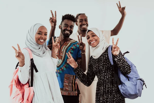 Group of happy african students having conversation and team meeting working together on homework girls wearing traidiional sudan muslim hijab fashion — Stock Photo, Image