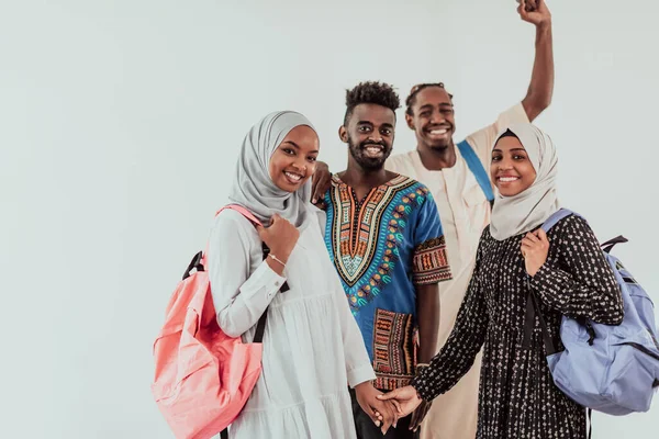 Group of happy african students having conversation and team meeting working together on homework girls wearing traidiional sudan muslim hijab fashion — Stock Photo, Image