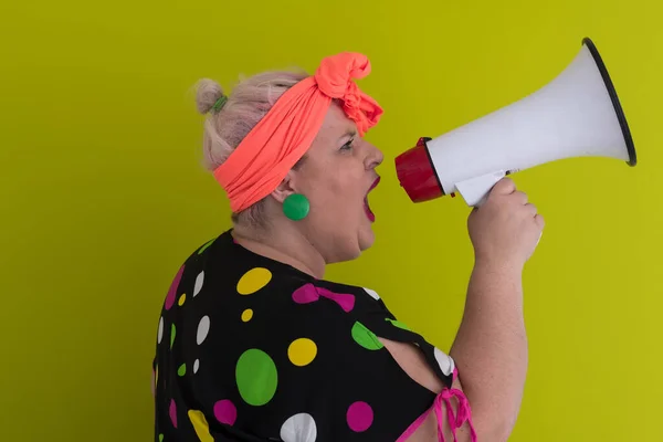 Funny plus size woman woman posing isolated on pastel green background studio portrait. People emotions lifestyle concept. Mock up copy space. Screaming in megaphone. — Stock Photo, Image