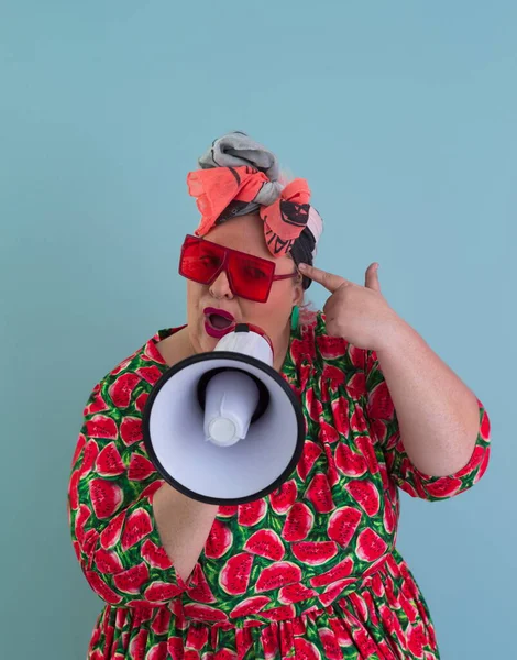 Funny plus size woman posing isolated on cyan background studio portrait. Screaming in a megaphone. People emotions lifestyle concept. Mock up copy space. — 스톡 사진