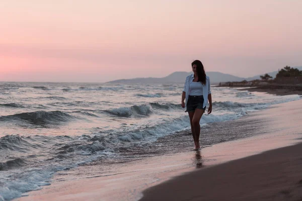 Happy Carefree Woman Enjoying Beautiful Sunset on the Beach. Selective focus — 图库照片
