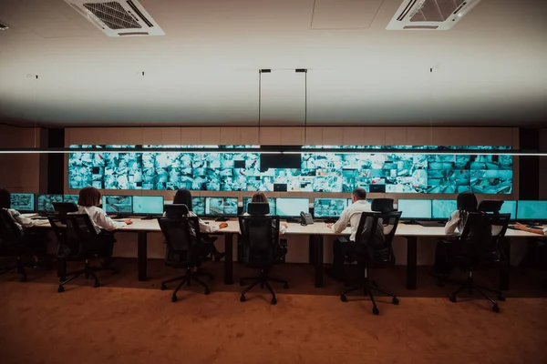 Group Security Data Center Operators Working Cctv Monitoring Room Looking — Foto Stock