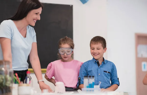 Elementary School Science Classroom Enthusiastic Teacher Explains Chemistry Diverse Group —  Fotos de Stock