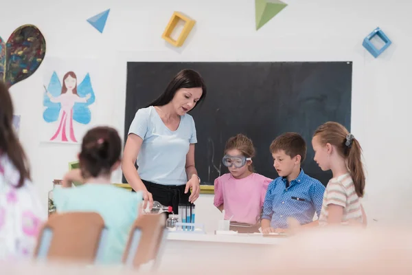 Elementary School Science Classroom Enthusiastic Teacher Explains Chemistry Diverse Group — Stock Fotó