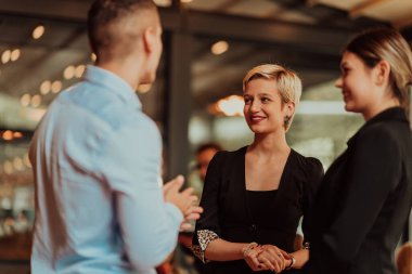 Photo of a business team of young people discussing business ideas in a modern urban environment. Selective focus. High quality photo