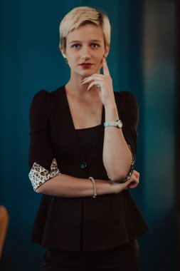 Pretty business woman, successful confidence on modern blue mat background. Selective focus. High quality photo