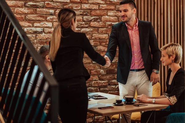 Business shaking hands, finishing up a meeting. Successful businesspeople handshaking after a good deal. High quality photo