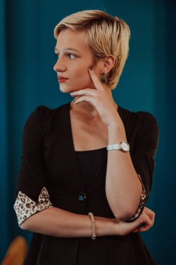 Pretty business woman, successful confidence on modern blue mat background. Selective focus. High quality photo