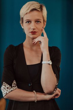 Pretty business woman, successful confidence on modern blue mat background. Selective focus. High quality photo