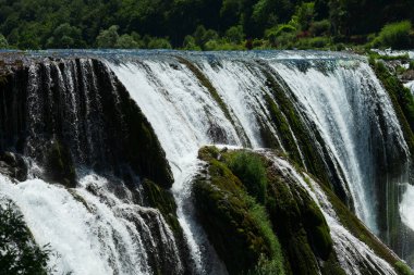 a magnificent waterfall called strbacki buk on the beautifully clean and drinking Una river in Bosnia and Herzegovina in the middle of a forest. High quality photo