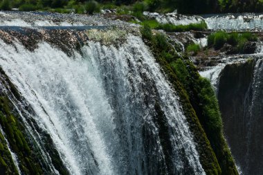 a magnificent waterfall called strbacki buk on the beautifully clean and drinking Una river in Bosnia and Herzegovina in the middle of a forest. High quality photo
