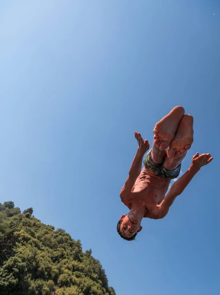 Young Teen Boy Jumping Flying Diving River Clear Blue Sky — Stock Photo, Image