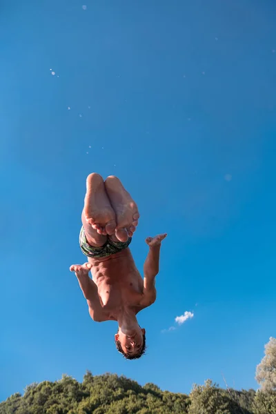 Young Teen Boy Jumping Flying Diving River Clear Blue Sky — Foto de Stock