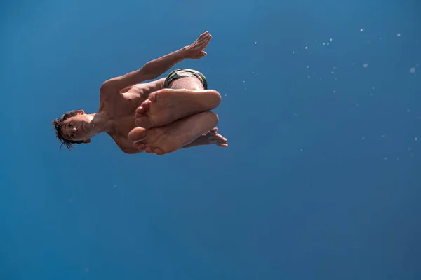 Young Teen Boy Jumping Flying Diving River Clear Blue Sky — Stock Photo, Image