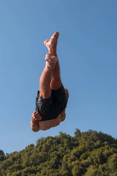 Young Teen Boy Jumping Flying Diving River Clear Blue Sky — Stockfoto