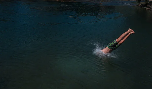 Young Teen Boy Jumping Flying Diving River Clear Blue Sky — Photo