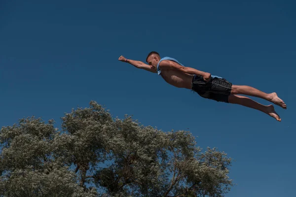 Young Teen Boy Wearing Towel Superhero Scarf Flying Diving River — Stok fotoğraf