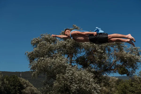 Young Teen Boy Wearing Towel Superhero Scarf Flying Diving River — Zdjęcie stockowe