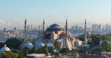 Istanbul, Turkey. Sultanahmet area with the Blue Mosque and the Hagia Sophia with a Golden Horn and Bosphorus bridge in the background at sunrise. Cinematic Aerial view. Hi quality 4K footage.
