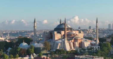 Istanbul, Turkey. Sultanahmet with the Blue Mosque and the Hagia Sophia with a Golden Horn on the background at sunrise. Cinematic Aerial view. Hi quality 4K footage.