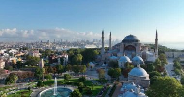 Istanbul, Turkey. Sultanahmet with the Blue Mosque and the Hagia Sophia with a Golden Horn on the background at sunrise. Cinematic Aerial view. Hi quality 4K footage.