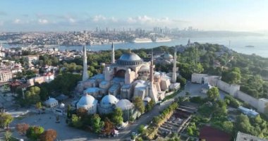 Istanbul, Turkey. Sultanahmet area with the Blue Mosque and the Hagia Sophia with a Golden Horn and Bosphorus bridge in the background at sunrise. Cinematic Aerial view. Hi quality 4K footage.