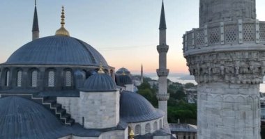 Istanbul, Turkey. Sultanahmet area with the Blue Mosque and the Hagia Sophia with a Golden Horn and Bosphorus bridge in the background at sunrise. Cinematic Aerial view. Hi quality 4K footage.