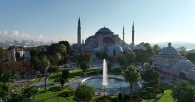 Istanbul, Turkey. Sultanahmet with the Blue Mosque and the Hagia Sophia with a Golden Horn on the background at sunrise. Cinematic Aerial view. Hi quality 4K footage.