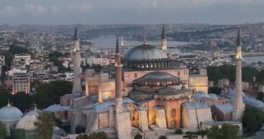Istanbul, Turkey. Sultanahmet area with the Blue Mosque and the Hagia Sophia with a Golden Horn and Bosphorus bridge in the background at sunrise. Cinematic Aerial view. Hi quality 4K footage.