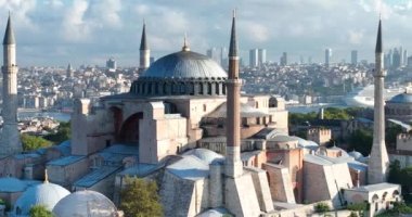 Istanbul, Turkey. Sultanahmet area with the Blue Mosque and the Hagia Sophia with a Golden Horn and Bosphorus bridge in the background at sunrise. Cinematic Aerial view. Hi quality 4K footage.