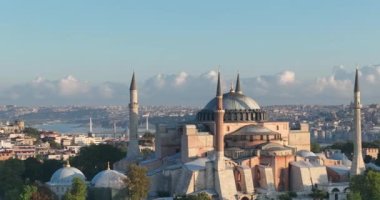 Istanbul, Turkey. Sultanahmet area with the Blue Mosque and the Hagia Sophia with a Golden Horn and Bosphorus bridge in the background at sunrise. Cinematic Aerial view. Hi quality 4K footage.