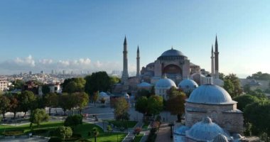 Istanbul, Turkey. Sultanahmet area with the Blue Mosque and the Hagia Sophia with a Golden Horn and Bosphorus bridge in the background at sunrise. Cinematic Aerial view. Hi quality 4K footage.