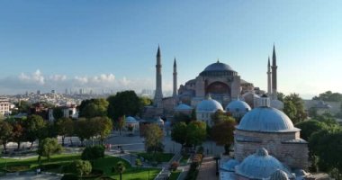 Istanbul, Turkey. Sultanahmet with the Blue Mosque and the Hagia Sophia with a Golden Horn on the background at sunrise. Cinematic Aerial view. Hi quality 4K footage.