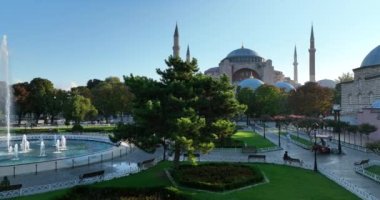 Istanbul, Turkey. Sultanahmet area with the Blue Mosque and the Hagia Sophia with a Golden Horn and Bosphorus bridge in the background at sunrise. Cinematic Aerial view. Hi quality 4K footage.