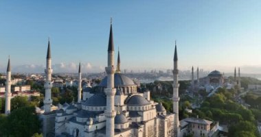 Istanbul, Turkey. Sultanahmet area with the Blue Mosque and the Hagia Sophia with a Golden Horn and Bosphorus bridge in the background at sunrise. Cinematic Aerial view. Hi quality 4K footage.