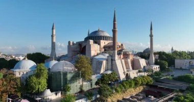 Istanbul, Turkey. Sultanahmet with the Blue Mosque and the Hagia Sophia with a Golden Horn on the background at sunrise. Cinematic Aerial view. Hi quality 4K footage.