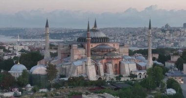 Istanbul, Turkey. Sultanahmet with the Blue Mosque and the Hagia Sophia with a Golden Horn on the background at sunrise. Cinematic Aerial view. Hi quality 4K footage.
