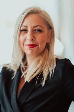 Portrait of a senior businesswoman in a modern corporation. Selective focus. High quality photo